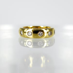 Image of 18ct yellow gold gypsy diamond set wedding band. PJ0779