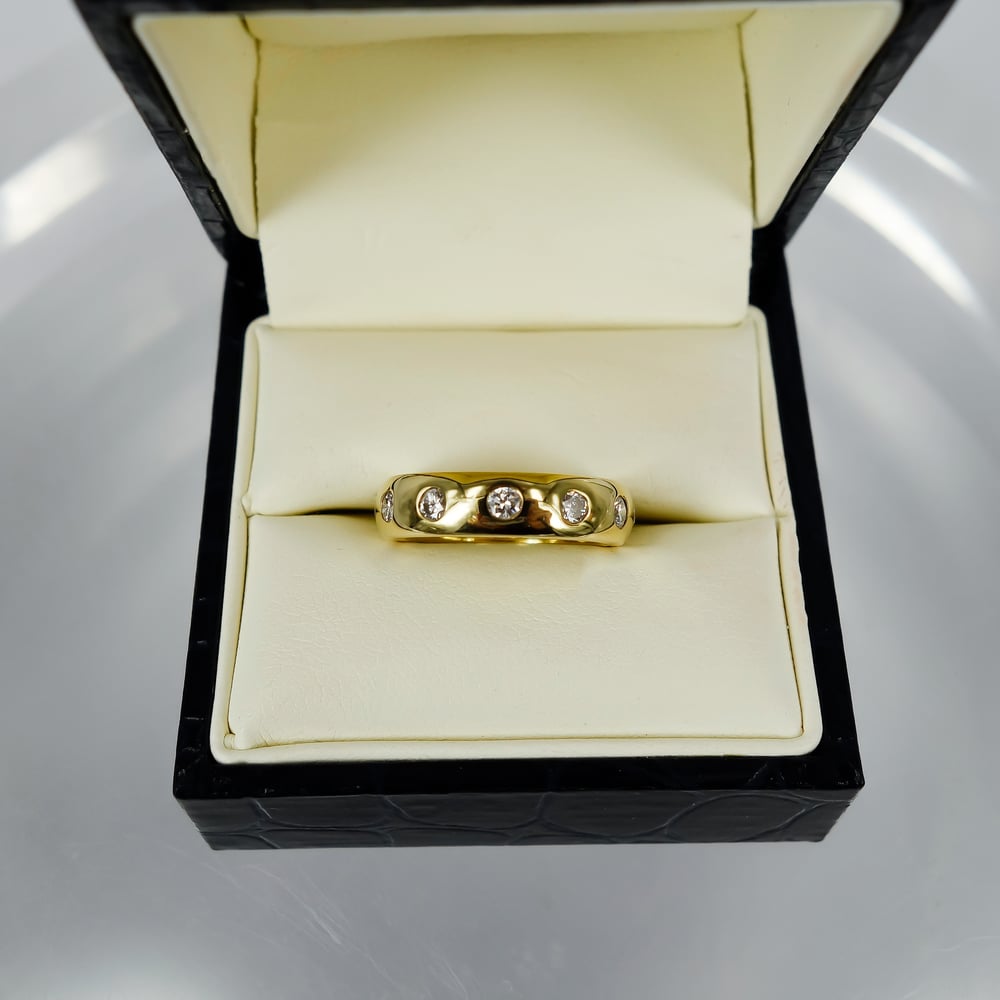 Image of 18ct yellow gold gypsy diamond set wedding band. PJ0779