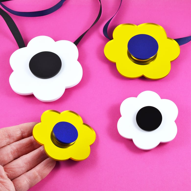 Image of Spinning Flower Necklaces and Brooches