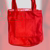 Image 1 of Bright red reversible wool bag with floral lining