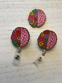 floral brain badge reel