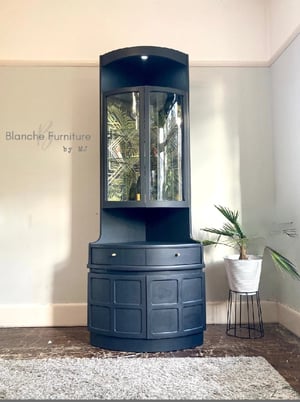 Image of Nathan Corner Drinks Cabinet unit with geometric lining.