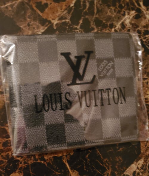 Image of Black/checkered wallet