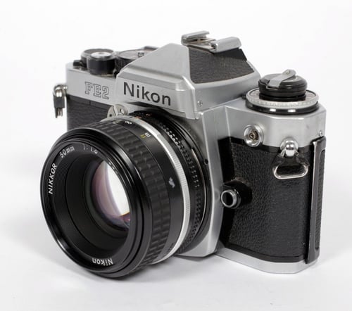 Image of Nikon FE2 35mm SLR Film Camera with 50mm F1.8 Nikkor lens #128