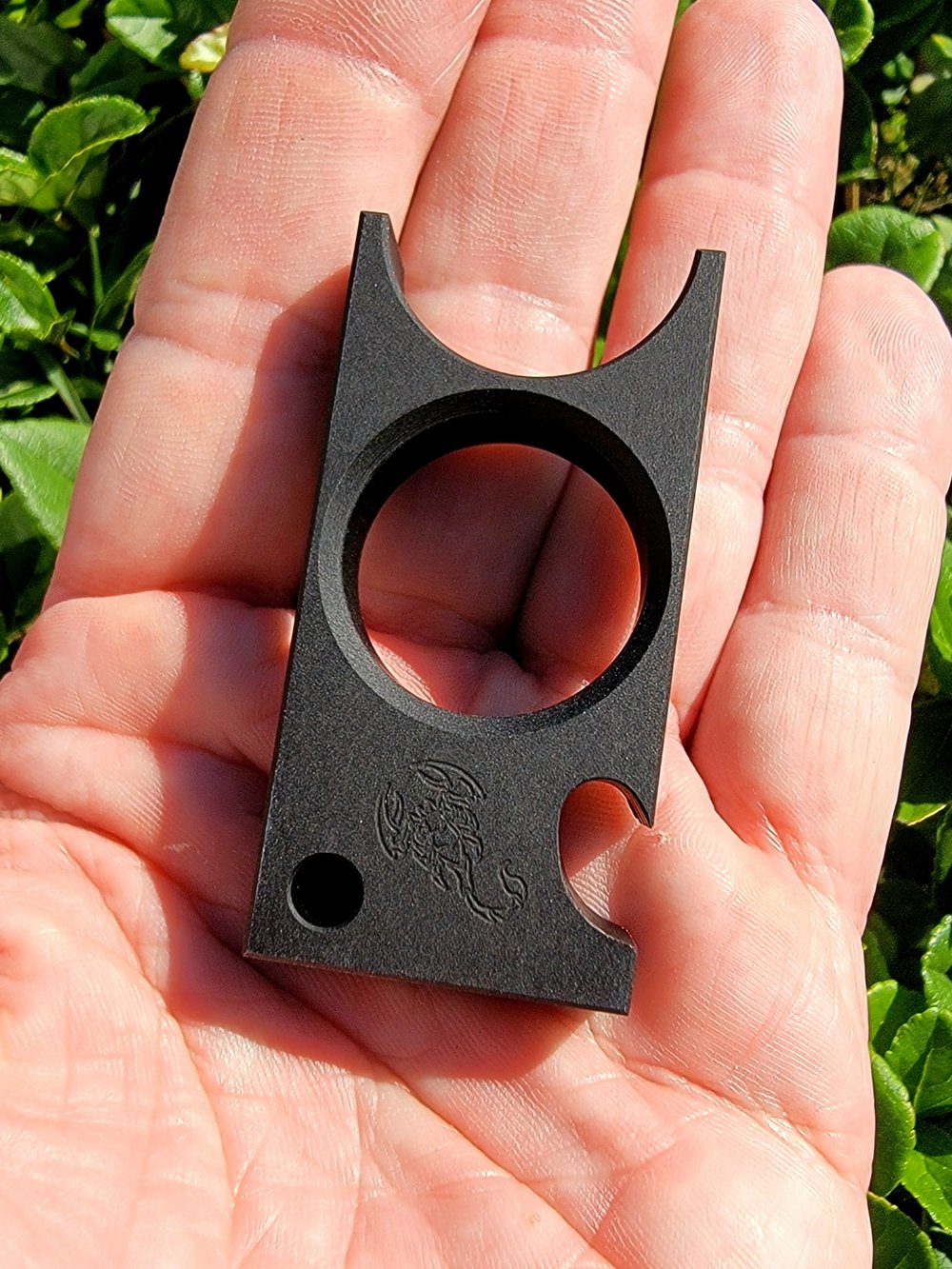 Cigar holder/bottle opener 