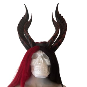 Image of demon horns from HURTS LIKE HELL video