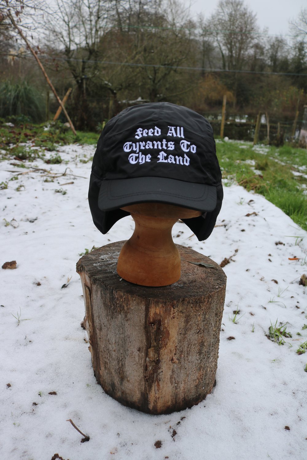 FEED ALL TYRANTS TO THE LAND  (trapper hat) PRE ORDER