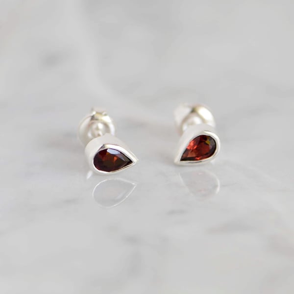 Image of Wine Red Garnet pear cut silver stud earrings