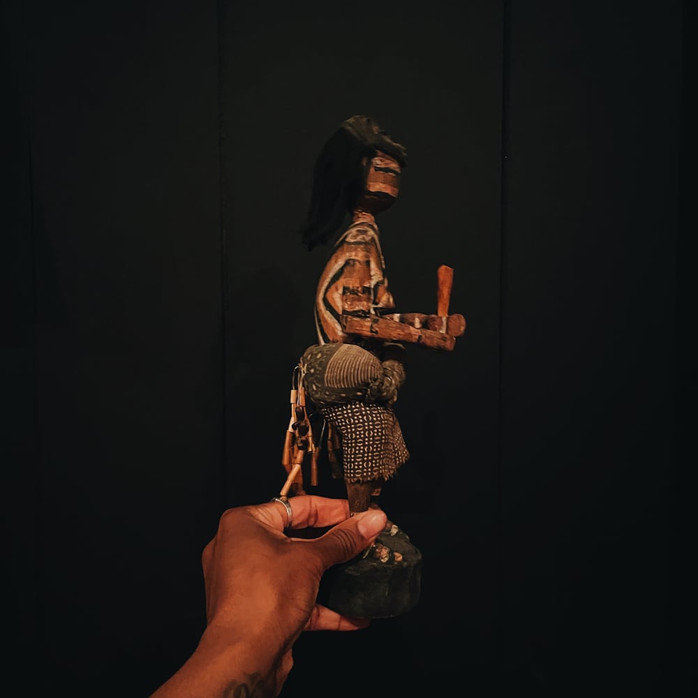 Carved Figure of a Woman with Mask