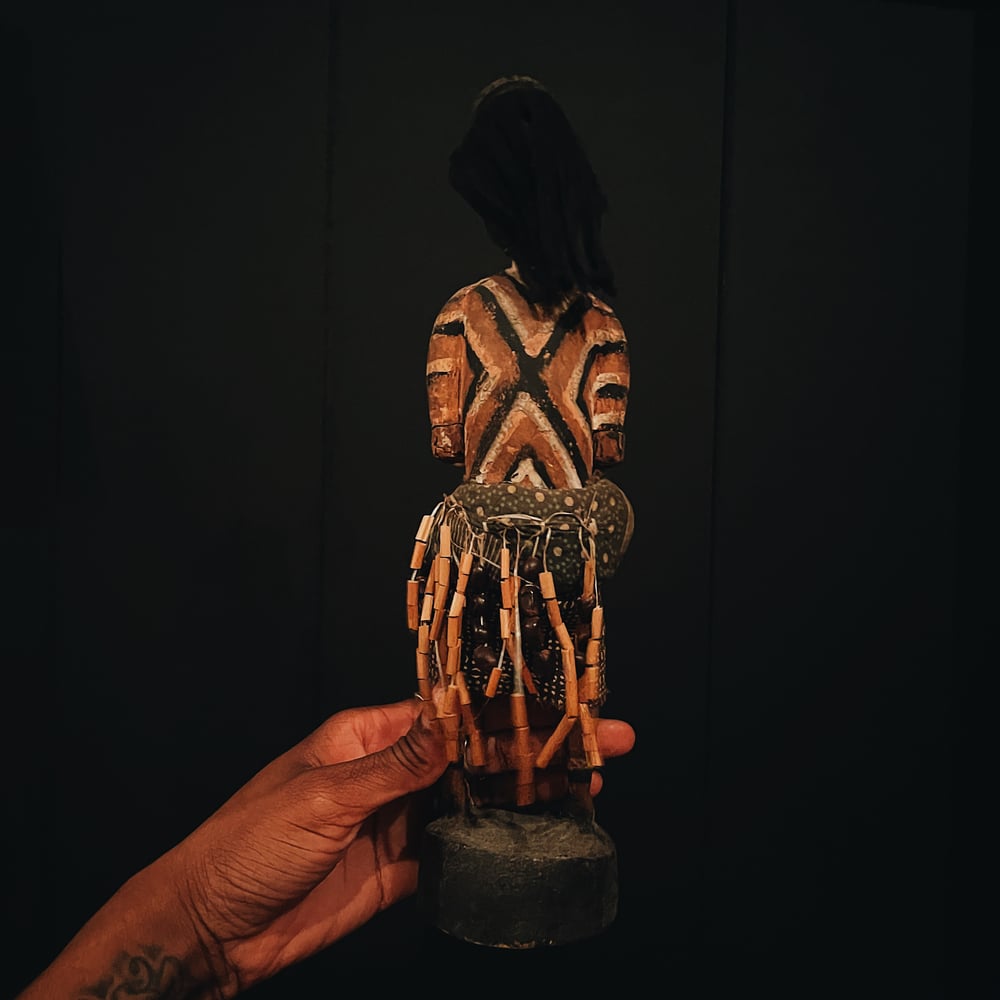 Carved Figure of a Woman with Mask