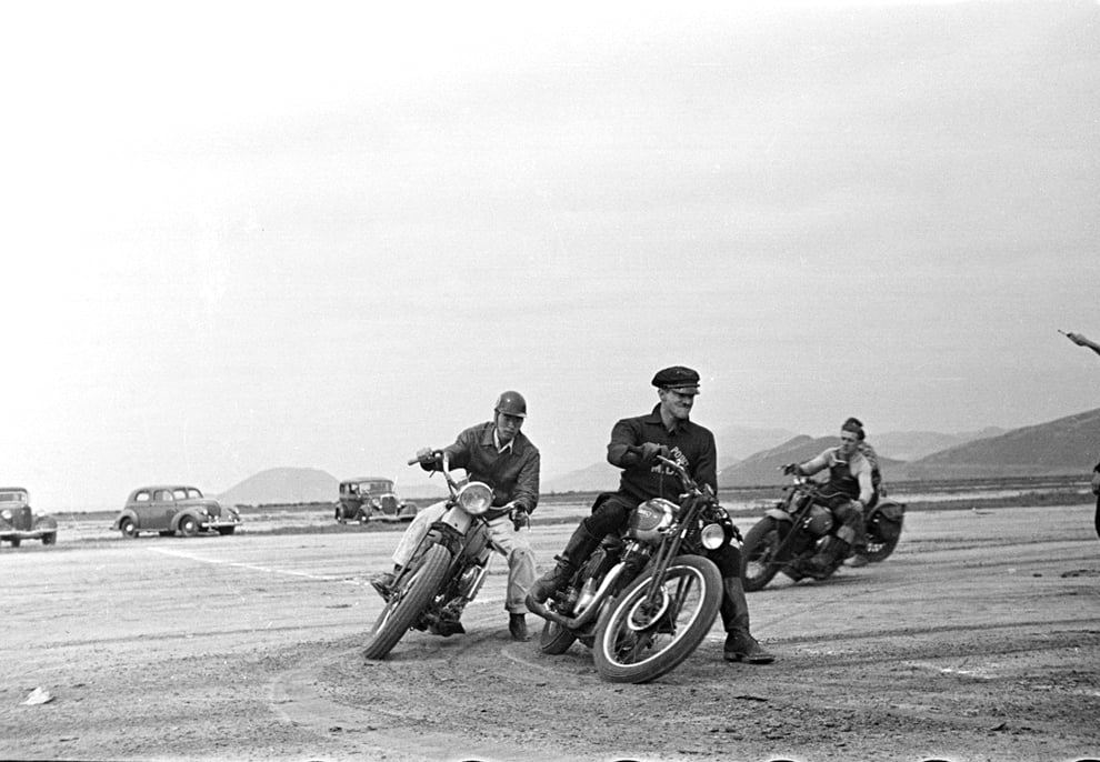 Image of Bikers Race In The Desert