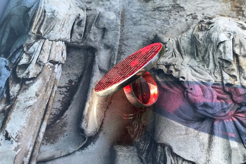 Image of "A fragment from Late Ancient Roman hymn to Sun.." silver ring with red acrylic glass 45mm