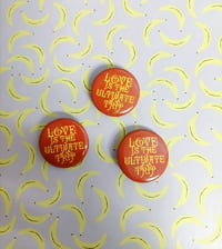 Image 1 of Love is the ultimate trip button💛 