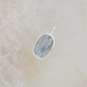 Image of Aqua Blue Kyanite crystal form oval shape mixed cut silver necklace
