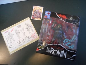 Image of Signed Last Ronin Previews Exclusive figure  with print and card