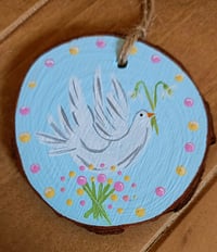 Image 1 of Dove on wood slice