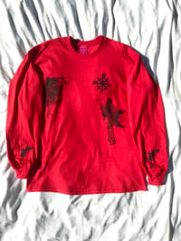 Image of strapped up long sleeve in red