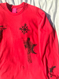 Image of strapped up long sleeve in red