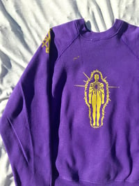 Image of this lil light sweater shirt in purple 