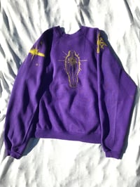 Image of this lil light sweater shirt in purple 