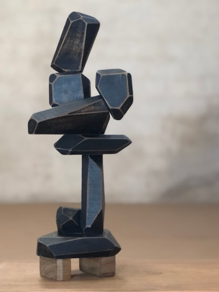 Image of solid teak sculpture (black)