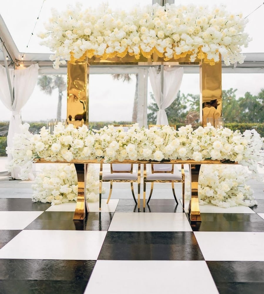 Image of Stage design gold  chrome backdrop and Artificial  flowers 