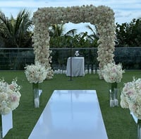WHITE WEDDING AISLE  AS SEEN WITH ARTIFICIAL FLOWERS SQUARE BACKDROP 