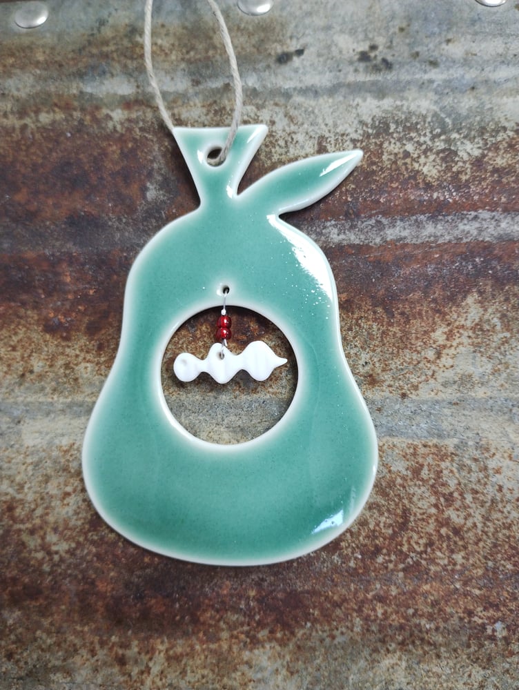 Image of Porcelain Pear and worm decoration