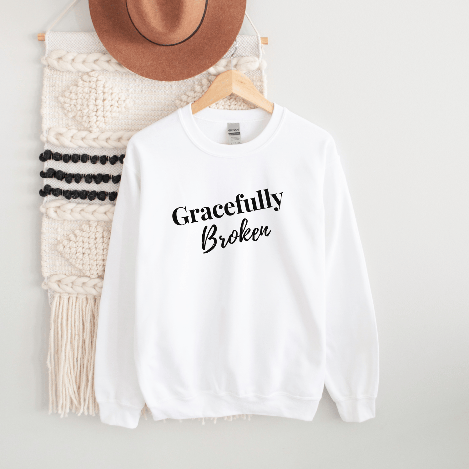 Image of White Unisex Sweatshirt. Gracefully Broken