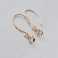 Image 4 of Tiny Golden Hoop Earrings Bezeled CZ Round