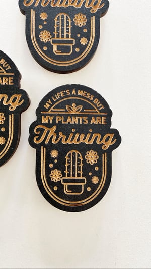 Image of “My life’s a mess but my plants are thriving” magnet