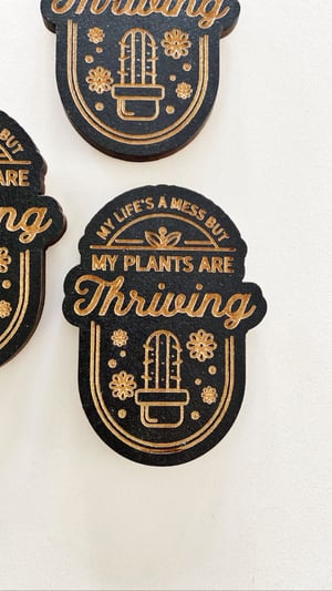 Image of “My life’s a mess but my plants are thriving” magnet 