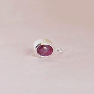 Image of Vietnam Red Star Ruby oval shape cabochon cut silver necklace