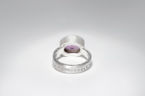 Image of "Everything divine and human" silver ring with amethyst  · DIVINA HUMANAQUE OMNIA ·