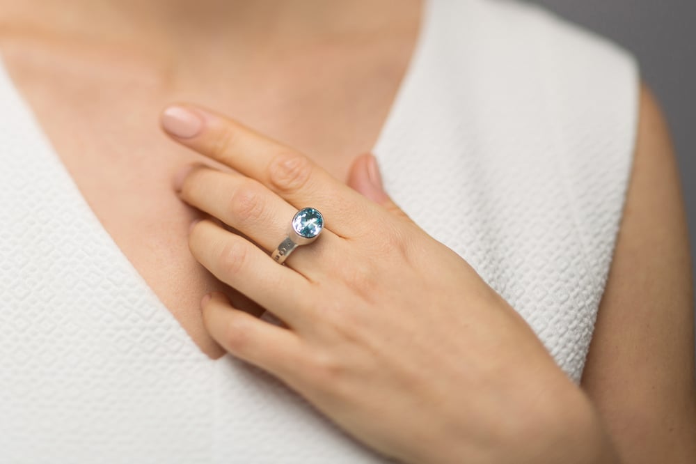 Image of sterling silver ring with blue topaz