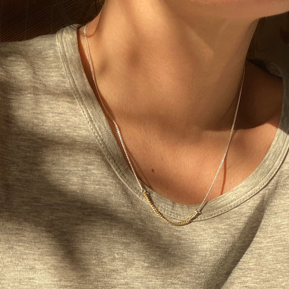 BICOLOR SUBTLETY 
WHERE SILVER UNITS WITH GOLD

Delicate silver gourmet chain necklace connected with 18K gold gourmet section, 46 or 48 cm long, with 2 options in gold section, 3,5 or 5,5 cm.

Charming in its simplicity