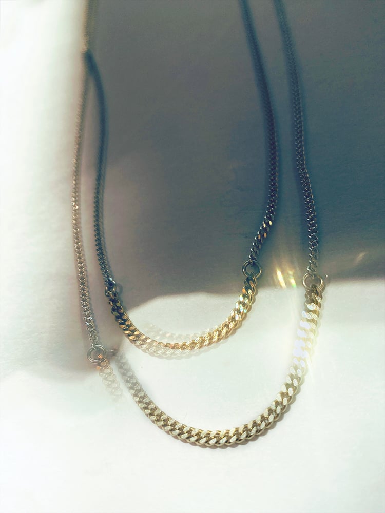 BICOLOR SUBTLETY 
WHERE SILVER UNITS WITH GOLD

Delicate silver gourmet chain necklace connected with 18K gold gourmet section, 46 or 48 cm long, with 2 options in gold section, 3,5 or 5,5 cm.

Charming in its simplicity