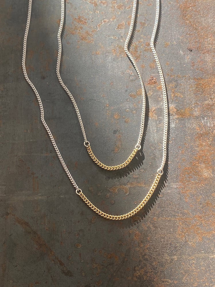 BICOLOR SUBTLETY 
WHERE SILVER UNITS WITH GOLD

Delicate silver gourmet chain necklace connected with 18K gold gourmet section, 46 or 48 cm long, with 2 options in gold section, 3,5 or 5,5 cm.

Charming in its simplicity