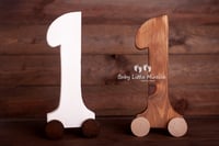 Wooden digit on wheels