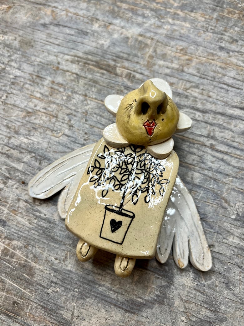 Image of Hearted Plant Garden Fairy