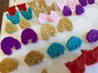 Image 1 of Dog head studs 