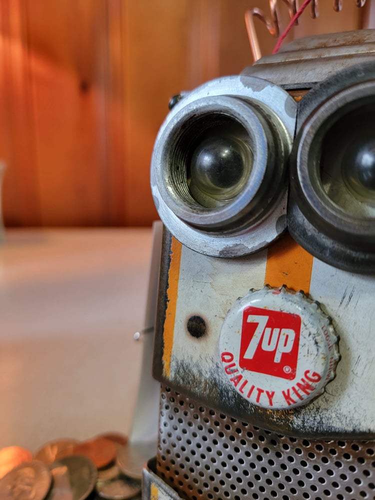 Image of Orange Quality king Robot penny bank