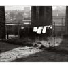 Under the viaduct.
