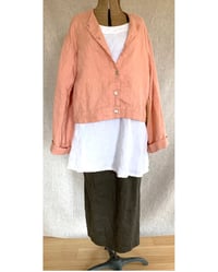 Image 1 of slightly cropped collarless jacket with bell sleeves