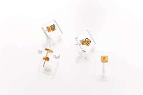 Image of gold plated silver earring with letter
