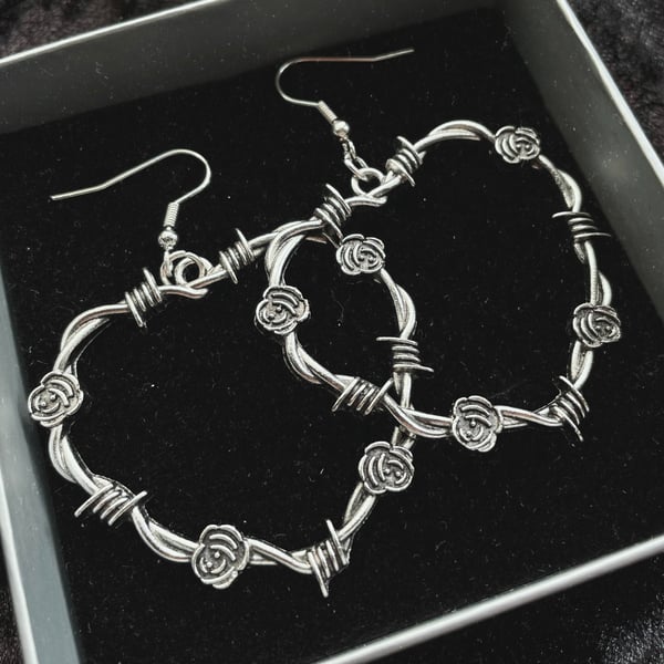 Image of Heavy petal large heart barbed wire rose earrings