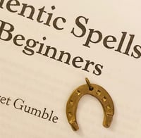Lucky amulet - miniature bronze horseshoe charm