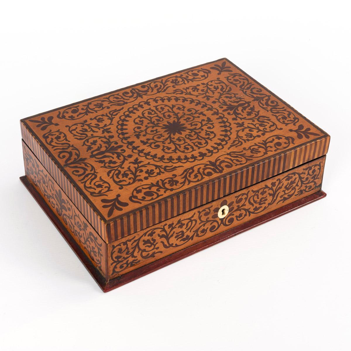 Image of 19th century maple and mahogany veneered jewelry box with patterned and scrolling marquetry