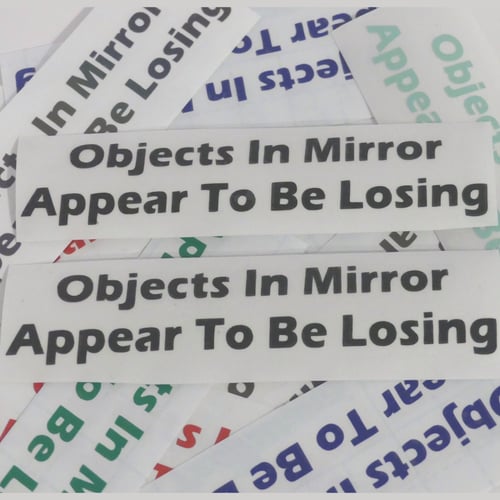 Image of 5" Objects In Mirror Appear To Be Losing Stickers