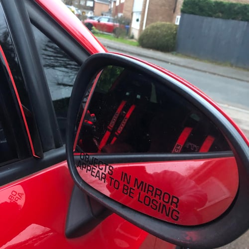 Image of 5" Objects In Mirror Appear To Be Losing Stickers